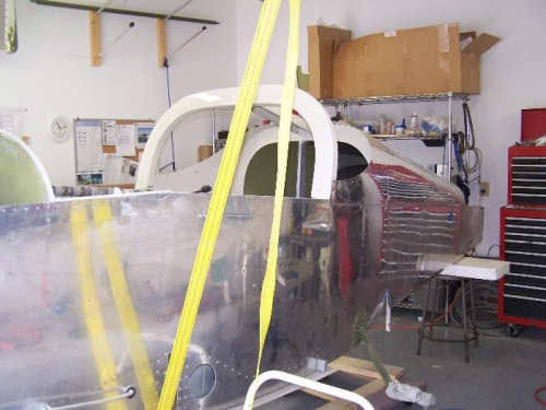 Using the strap to work the fuselage up.