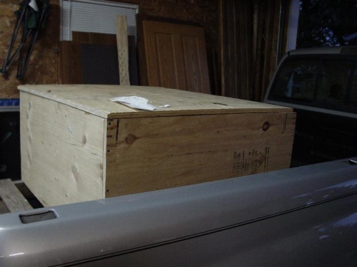 Here is the crate with the engine inside on the back of my truck.