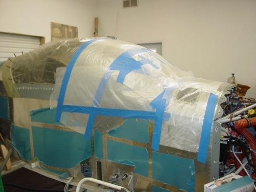 Here I put down a layer of wax paper as  a release agent for the fiberglass.