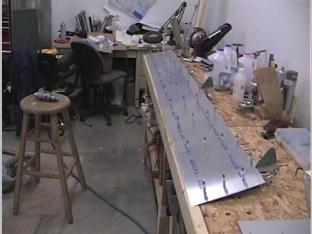 fitting the bottom skin to the left flap.