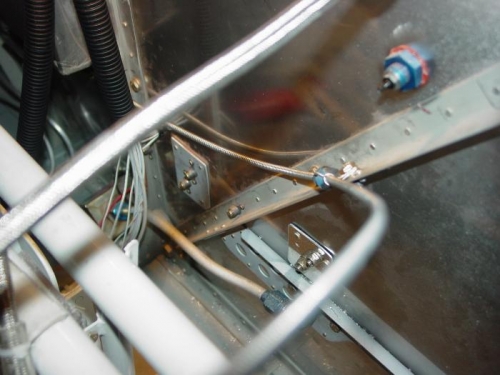 Installed an adel clamp on the firewall brace to hold the cable as it turned towards the heater door.