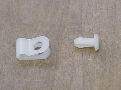 Here is a plastic clip and push pin for the vacume line.