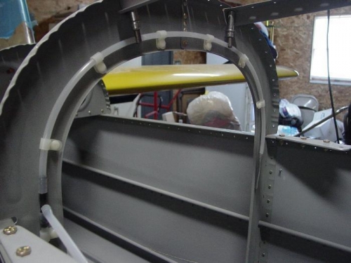 Here is the vacume line held on by the plastic clips and push pins.