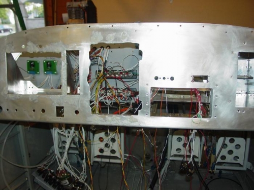 Fiberglassed over all the rivits in the front of the panel for the final look.