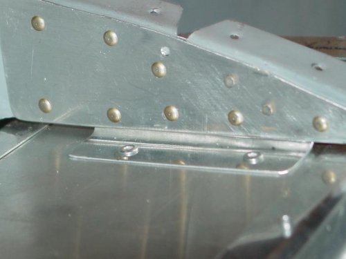 Rivited the glove box to the subpanel.