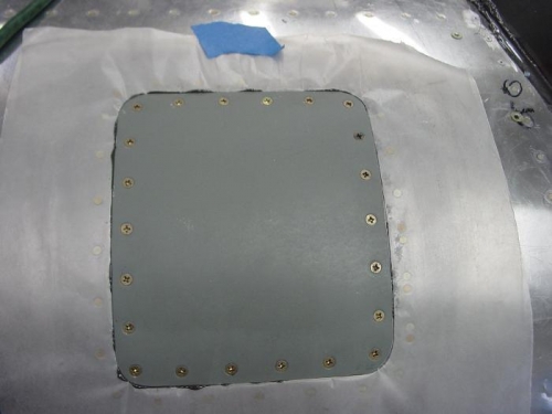 Panel screwed down to spread out the pro seal to make a gaskit.