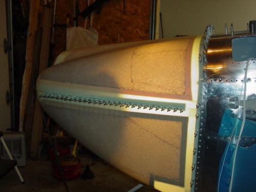 You can see clecoes holding the strip  between the two halves.