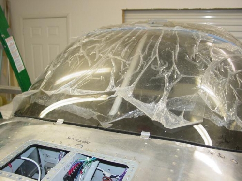 Here are a couple of the clips that hold the front of the windshield down.