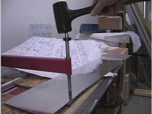 Dimpling one of the aileron skins.