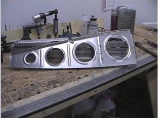 Deburing the wing ribs.