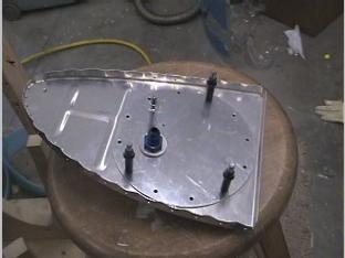 Fit the fuel line fitting in the cover plate.