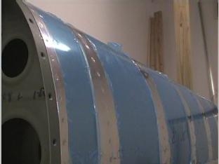 Riviting the leading edge to the short ribs.