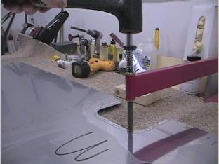 Dimpling the holes for the platenuts for the inspection plate.