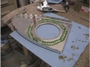 Riviting the platenuts and ring stifner to inspection plate.