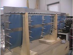 Drilling the skin to the ribs on the left fuel tank.