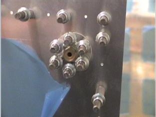 Drilling the drain plug to the skin of the left furl tank.