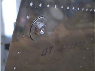 Outside of the sealed fuel drain.