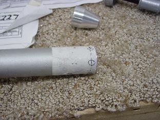 Locating the places on the tub to drill the six holes.