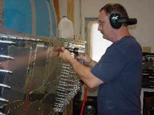 We are riviting the top skins on.