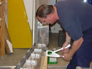 Here I am crimping rivits on the rear baffel.