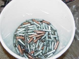 Bucket with thinner and clecoes.