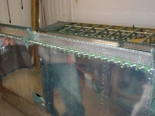 Large bottom skin with clecoes in.