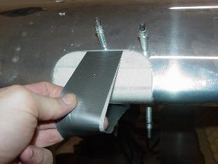 Here I am drilling the lens to match holes in the leading edge.