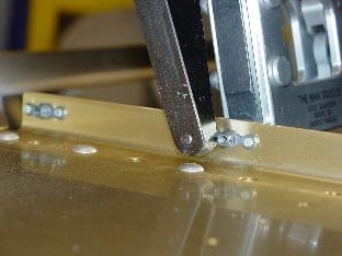 Here I am squeezing a rirvit to hold on the nutplate.