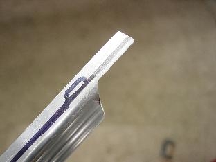 Here is one end of a J channel trimed to fit the bulkhead.