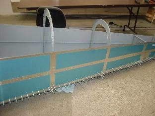 Hereis the left side of the fuselage after riviting.