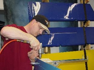 Here I am drilling the side doubler to the bulkhead.