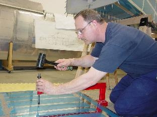 Dinpling the holes in the skin of the center section.