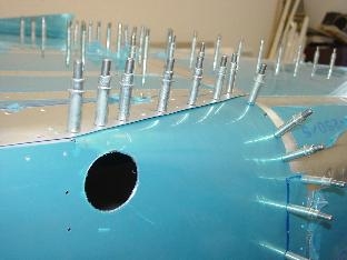 Hrere it is mounted to the bottom skin.