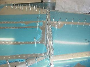 Here the the bottom skin is drilled to the rear fuselage.
