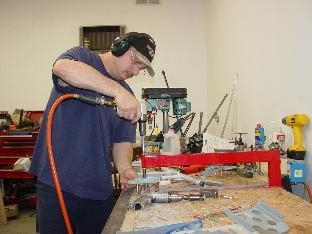 Here i  am riviting on of the brake peddles together.