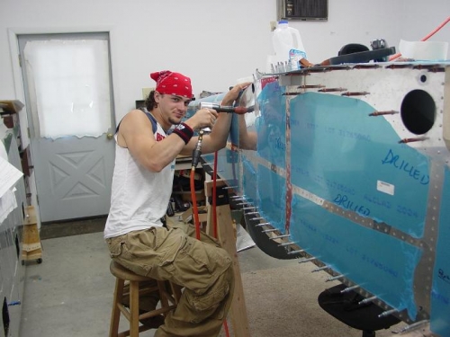 Here is Jacob rivitingon the outside of the fuselage.