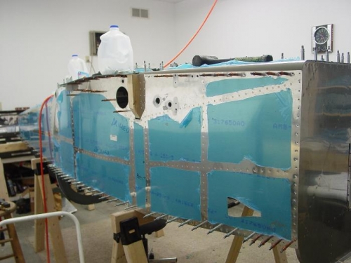 Here is a view of the right side of the fuselage with most of the rivits set.