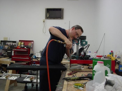 Here I am riviting the bulkhead to the rear deck.