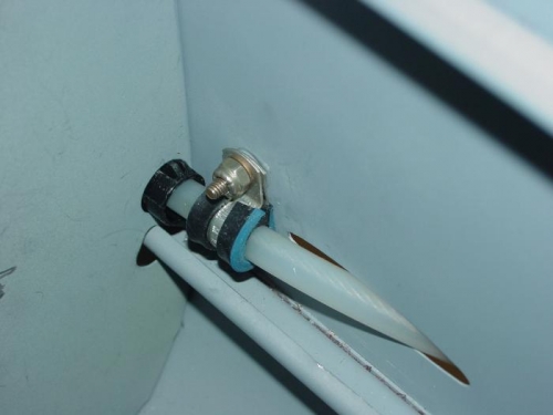 Here is a clamp on one of the cables going through the side of the fuselage.