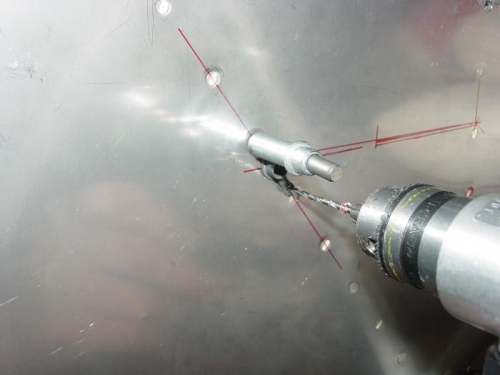 here I am drilling a rivit hole for the 1/4 nut plate.