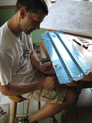 I used my nibbler to notch the bulkhead for the shoulder harness cable.