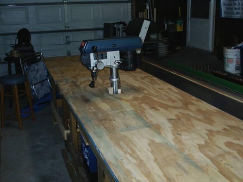 Drill press through work bench