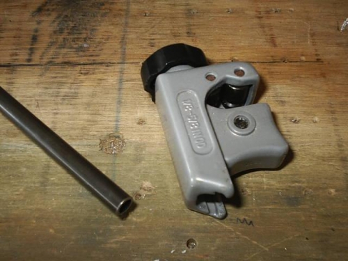 Regular plumbing tubing cutter used to cut bushing