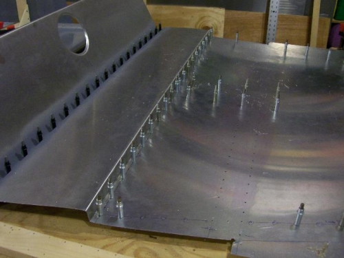 Joining the cabin floor and gear channel