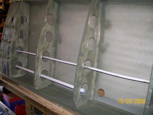 Thin wiring conduit on top - steam lines on bottom