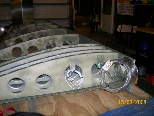 Hose coils at the wing root