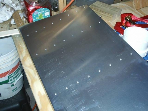 Internal ribs riveted in place