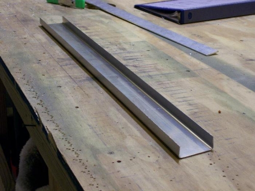 This rivets to the firewall inside the cabin