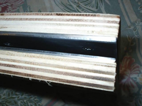 Close-up of plywood and aluminum