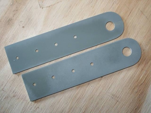 Aileron control horns with pilot holes for rivets